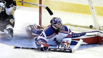 Maxime Talbot slides past the net as the puck sails over the pads of Rangers goalie Henrik Lundqvist in the first period Saturday night. Talbot's goal was his fifth of the season. (vs. Rangers 11/17/07)