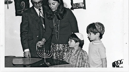 Cookbook author Judy Bart Kancigor, her husband, Barry, and sons Brad, left, and Stu on the first night of Hanukkah, 1970.