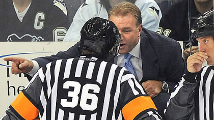 
Penguins head coach Michel Therrien argues with referee Dean Morton.