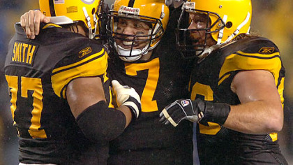Steeler quarterback Ben Roethlisberger celebrates with guard Alan Faneca and tackle Marvell Smith after throwing his second of five touchdown in the first half against the Ravens.(vs. Ravens 11/05/07)