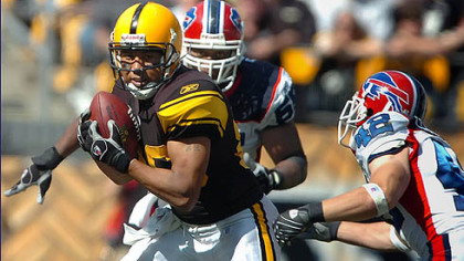 Steelers wide receiver Hines Ward picks up yardage.
