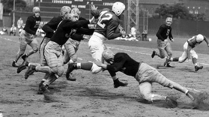 Marshall Goldberg, the former Pitt All-America who played for the Chicago Cardinals in the NFL, runs through Steelers tacklers at Forbes Field in 1940.