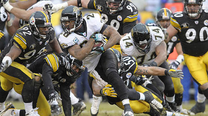 Jaguars running back Fred Taylor picks up a first down against the Steelers in the second half. (vs. Jaguars 12/16/2007)