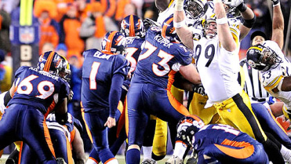 Broncos kicker Jason Elam kicks the game-winning field goal.
