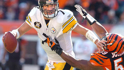 Roethlisberger breaks away from linebacker Landon Johnson Sunday.