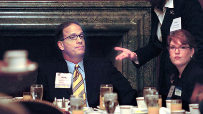 Republican mayoral candidate Mark DeSantis is asked by Sara Davis Buss, moderator of a breakfast at the Duquesne Club, Downtown, yesterday, to leave so Mayor Luke Ravenstahl would speak to the Executive Women's Council of Greater Pittsburgh. At right is Meghan Jones Rolla of Mr. DeSantis' campaign staff.