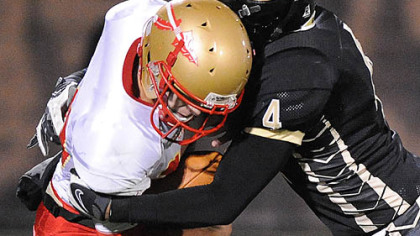 Gateway's James Wilson sacks Penn Hills quarterback Tom Fulton in the first quarter.