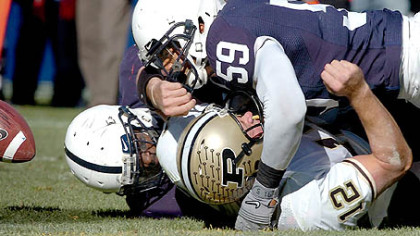 Penn State's Aaron Maybin forces a fumble by Purdue quarterback Curtis Painter late in a win yesterday at Beaver Stadium as the Nittany Lions' defense help preserve their seventh victory of the season.