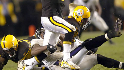 Steelers quarterback Ben Roethlisberger scrambles as he tries to avoid a sack in the second quarter.(vs. Ravens 11/05/07)