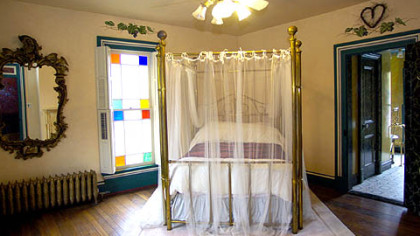 One of five bedrooms in the house. Many of the period details of the house have been restored.