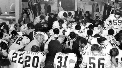 Steelers owner Art Rooney, center in dark suit, joins his team in prayer in the dressing room after they won Super Bowl IX in New Orleans over the Minnesota Vikings, 16-6.