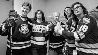 The "Hanson Brothers" of "Slap Shot" fame pose with Mario Lemieux, left, and NHL legend Gordie Howe in 1995.