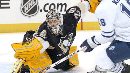 Penguins Marc-Andre Fleury makes save on Leafs Chad Kilger in the first period.