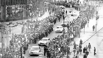 Police cars lead the Super Bowl IX champion Steelers through Gateway Center and down to Liberty Ave.