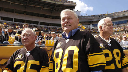 Former Steeler Jack Butler, center, along with several other old time Steeler players were honored at halftime.