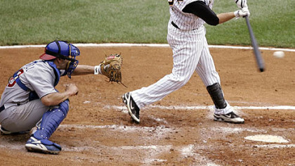 
Freddy Sanchez hits a triple with the bases loaded as Chicago Cubs catcher Jason Kendall catches in the second inning yesterday. Sanchez drove in three runs with the hit, but was out at the plate when he tried to stretch the triple to an inside-the-park home run.