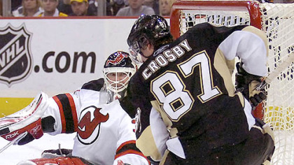 New Jersey goalie Martin Brodeur, left, denies Sidney Crosby last night at Mellon Arena.