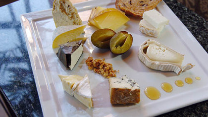 Eleven in the Strip District's artisan cheese plate includes, starting with the double stacked pieces in upper right and going clockwise: Capriole (Greenville, Ind.) Old Kentucky Tomme (goat); Zingerman's Creamery (Ann Arbor, Mich.) Lincoln Log (goat); Jasper Hill Farm (Greensboro, Vt.) Bayley Hazen Blue (cow); Old Chatham (N.Y.) Sheepherding Co. Camembert (sheep); Capriole O'Bannon (goat); Bellwether Farms (Sonoma, Calif.) Carmody (cow); Hendricks Farms and Dairy (Telford, Pa.) Grass Stain (cow); and  Uplands Cheese Co. (Dodgeville, Wisc.) Pleasant Ridge Reserve (cow).