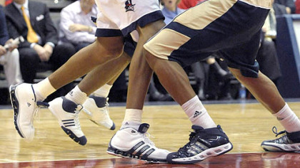 Duquesne's Kieron Achara pulls in a rebound against Pitt's Tyrell Biggs last night. Achara finished with nine points and three rebounds.  (at Dukes 12/05/2007)