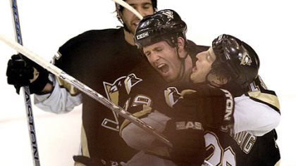 Ryan Whitney, center, celebrates with Colby Armstrong, right, after Armstrong scored the winning goal against the Rangers last season. Whitney, with 59 points, was on the ice for a lot of big moments in the Penguins' 105-point season.