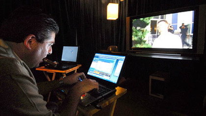 Mike Wittlin, president and chief executive officer of Smithfield Street Productions, watches scenes and makes notes at his office in Green Tree.