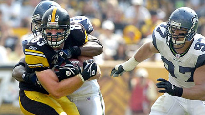 Steelers tight end Heath Miller leads the team with 22 catches, including four touchdowns. Here he pulls in a pass as he's defended by Seahawks Deon Grant and Patrick Kerney earlier this month.