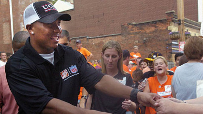Hines Ward shakes hands with the fans and volunteers from Home Depot, the non-profit organization KaBoom! and other community members who joined forces yesterday to build a playground in Spring Garden.