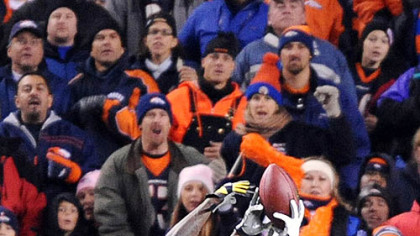 Santonio Holmes has the ball taken away by the Broncos' Dre Bly.