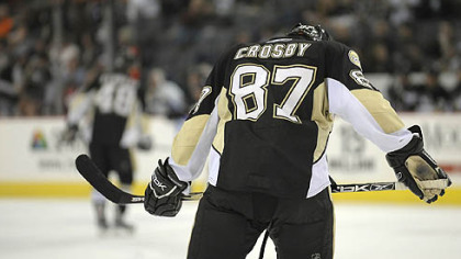 Sidney Crosby, making a pass around Anaheim's Sean O'Donnell, has just one point in his first two games this season, an assist on Ryan Malone's winning goal Saturday night.