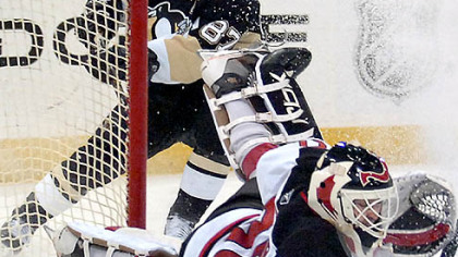 Devils goalie Martin Brodeur makes one of his 25 saves last night, this time stopping Sidney Crosby on a breakaway in the second period.