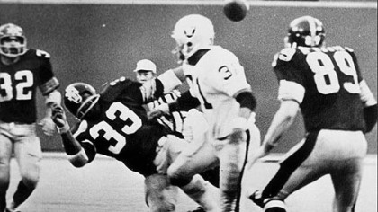 Franco Harris, far left, sees the ball fly into the air after the Oakland Raiders' Jack Tatum decks the Steelers' Frenchy Fuqua (33), setting up the "The Immaculate Reception."