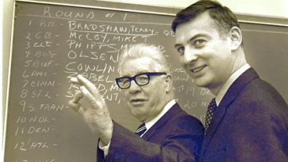Pittsburgh Steelers owner Art Rooney, left, gestures as he discusses the signing of quarterback Terry Bradshaw, as his son, Dan, looks on in Pittsburgh, in this January 27, 1970 photo.