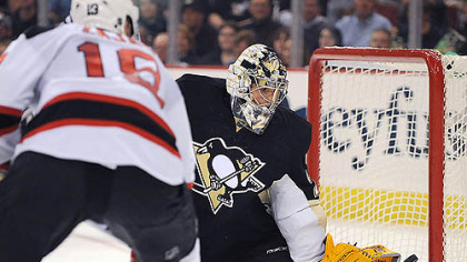 Penguins goalie Marc-Andre Fleury makes a save on the Devils' Dainius Zubrus.