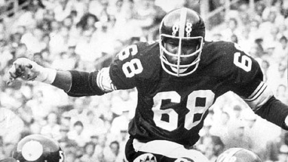 Cleveland quarterback Brian Sipe, 17, is sacked for a loss by Dwight White, 78, and L. C. Greenwood, 68, 1976.