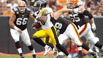 Deshea Townsend runs back an interception on a ball intended for the Browns' Tim Carter in the first quarter of the opener.