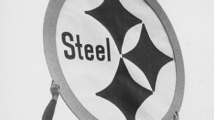Steelers John Henry Johnson, left, Bobby Layne, Dick Hoak and Buddy Dial hold the original Steelmark in 1962. The logo was adopted that year for the team's helmets.