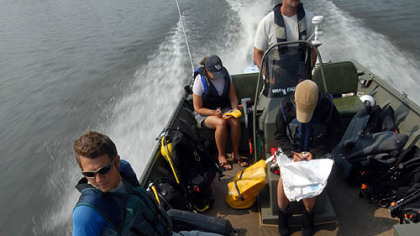 The Conservancy study team heads up the Allegheny River in Pool 6 to a new dive location. Left to right: Jake Winkler, aquatic ecologist intern and diver; Beth Meyer, assistant zoologist; Eric Chapman, director of aquatic science (driving); and Tamara Smith, aquatic ecologist and diver.