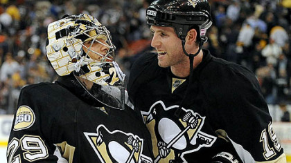 Marc-Andre Fleury, left, is congratulated by Ryan Whitney after Fleury shut out the Rangers, 1-0, last night at Mellon Arena.