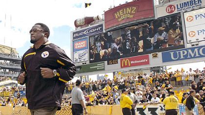 Steelers head coach Mike Tomlin takes the field.
