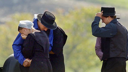 Members of the Nickel Mines Amish community came together to share their sorrow the day after the shooting a year ago that left five girls dead. When the community reached out to the widow and parents of the murderer they sparked a national conversation on the power of forgiveness.