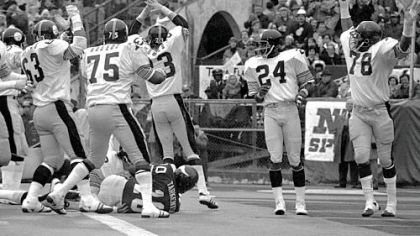 The Pittsburgh Steelers defense react as Minnesota Vikings' quarterback Fran Tarkenton (10) recovers his own fumble in the end zone for a safety in second quarter of Super Bowl IX in New Orleans at Tulane Stadium, in this Jan. 12, 1975 photo. Identifiable players are Steelers' Ernie Holmes (63), Joe Greene (75), and Mike Wagner (23). The Steelers won 16-6. The play was the first safety in Super Bowl history.