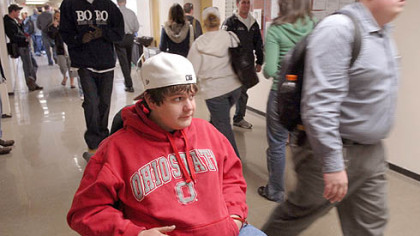 Ryan Ballou waits in a hallway for class at Edinboro University. After a difficult first year in which he nearly flunked out, Ryan, of Ben Avon, has returned to the school, determined to raise his grades.