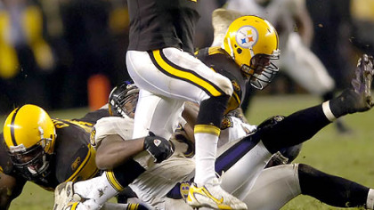 Quarterback Ben Roethlisberger scrambles as he tries to avoid a sack in the second quarter. (vs. Ravens, 11/05/07)