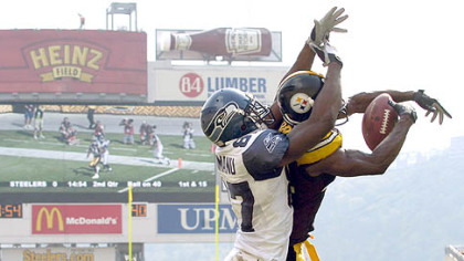 Steelers cornerback Ike Taylor tries to get a hand on the Bills Lee Evans.