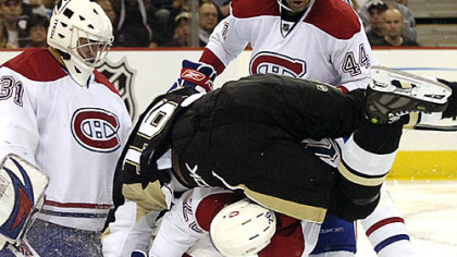 Josh Gorges upends Erik Christensen in front of Montreal's net in the second period last night at Mellon Arena.