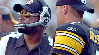 Steelers coach Mike Tomlin shakes hands with quarterback Ben Roethlisberger after the Steelers defeated the Seahawks, 21-0.