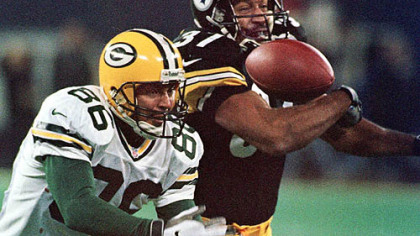 Steelers cornerback Carnell Lake reaches for a pass tipped by Green Bay Packers Antonio Freeman, 1998.