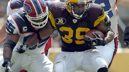 Parker gets pressure from Bills Angelo Crowell in the first quarter.