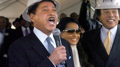 Casino owner Don Barden calls out "Gentlemen, start your engines" to heavy equipment operators taking part in yesterday's ground breaking ceremony on the North Shore. He was joined by singer Smokey Robinson, right, and Frances Glandney, Mr. Robinson's wife.