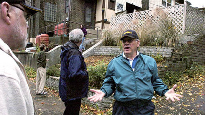 Squirrel Hill resident Dale Carney talks to Bruce Golden, left, of the Western Pennsylvania Coalition for Abandoned Mine Reclamation.